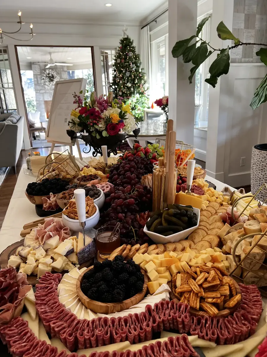 Grazing spread with crackers fanned around bowls of nuts and dried fruit