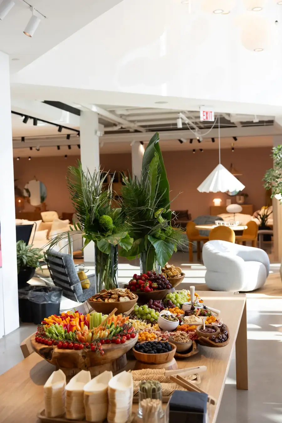 Styled buffet with individual cups, tarts and a floral centerpiece